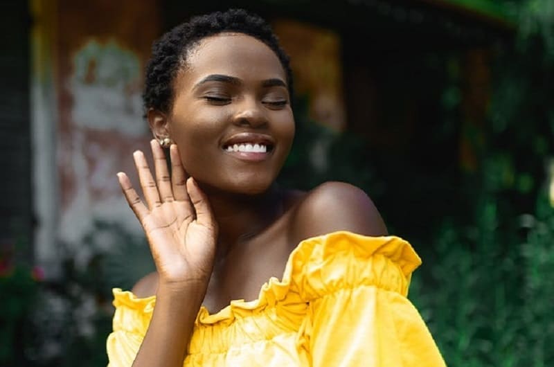 beautiful smiling woman in yellow dress